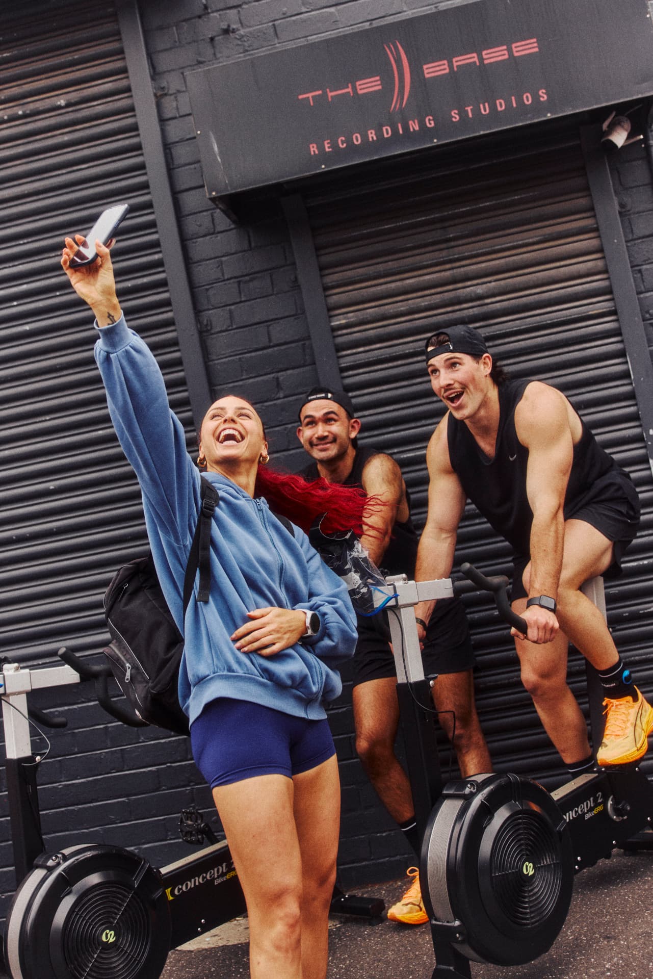 Athletes celebrating with a selfie at the bike ergs